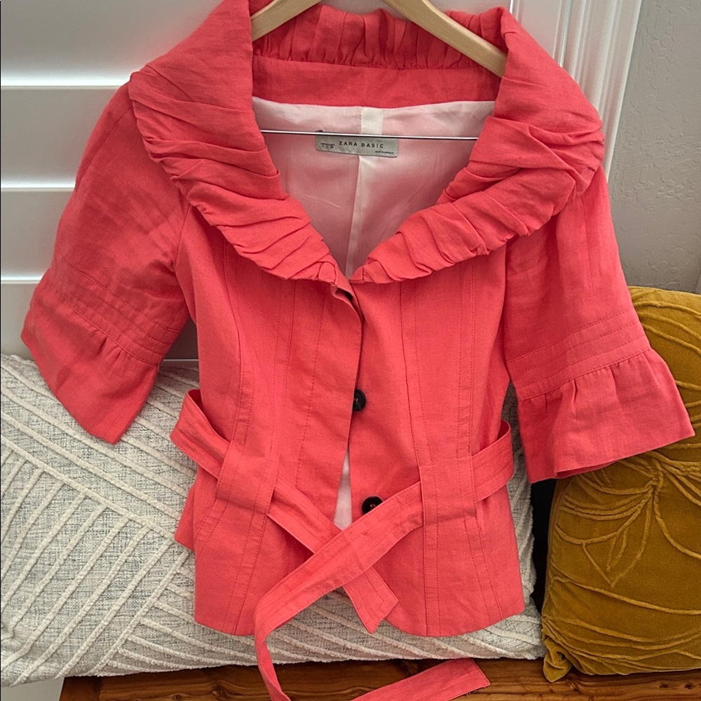 Cute summery light weight coat.  Peachy color.
